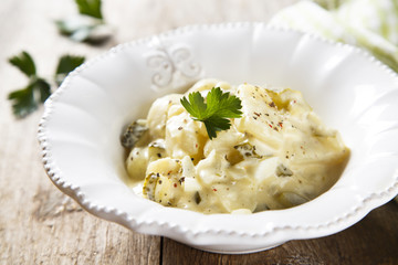 Potato salad with eggs and gherkins