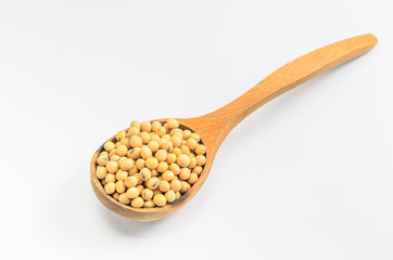 soybeans with wooden spoon on white background..