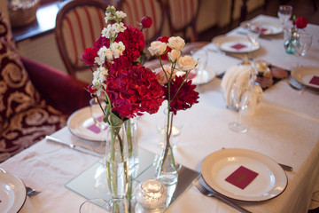 interior of the restaurant,  large table laid for  Banquet