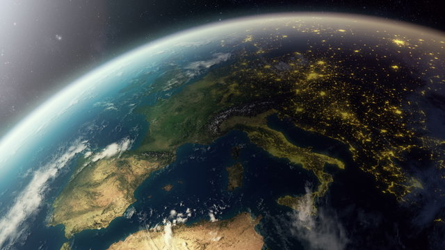 Photorealistic 3d Animation showing europe from space. As it gets dark you see cities light up.