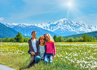 Summer dandelion meadow and family (Italy).