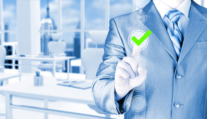 business man touching, pressing modern button with green ticking