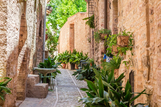 Fototapeta Beautiful decorated porch in small town in Italy in sunny day, Umbria