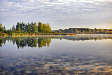 Water landscape with clouds reflection