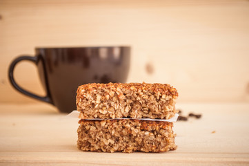 Energy bars and coffee in a cup