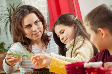 Happy young family getting ready for the Advent, Christmas holid