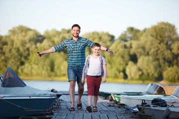 Man and boy fishing on the lake