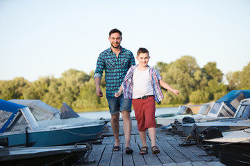 Man and boy fishing on the lake