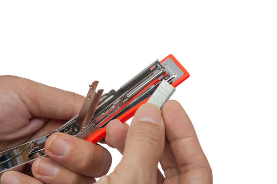 Add staples are put into the stapler, Isolated on a white backgr