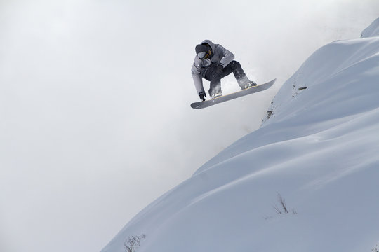 Flying skier on mountains, extreme sport