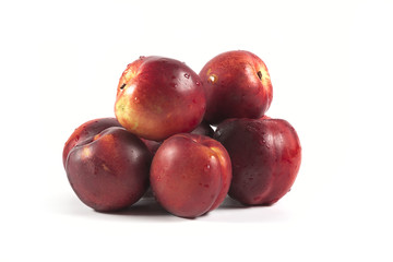 Fototapeta na wymiar Fresh ripe red peaches with water drops isolated on white