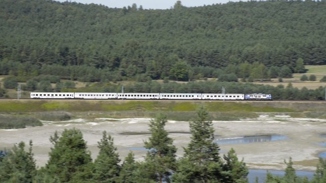 Classic Polish train on high-speed line in the picturesque scenery.