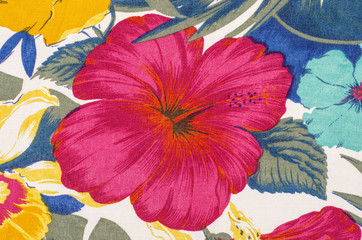 Floral pattern on white fabric. Big red flower print as background.