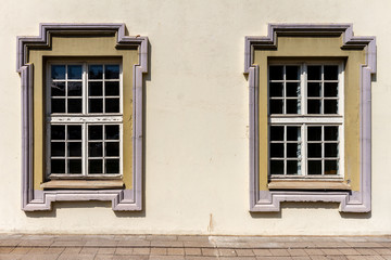 Fototapeta na wymiar Wall with two windows