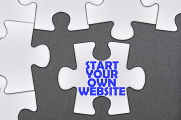Fototapeta premium jigsaw puzzle written word start your own website