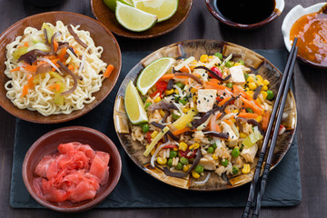 asian lunch - fried rice with tofu and vegetables, top view
