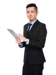 Asian Young Businessman use of the tablet pc