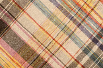 Scottish tartan pattern. Orange and green with yellow plaid print as background. Colored lines and square pattern. Scottish checked fabric. - 94014469