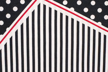  Polka dots and stripes pattern. White dots and half vertical stripes print on dark blue as...
