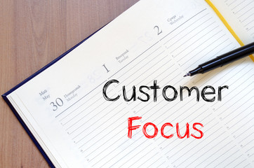 Customer focus write on notebook