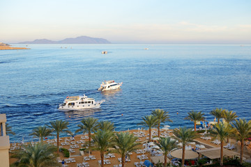 Obraz premium Sunset at Naama Bay, Red Sea and motor yachts, Sharm el Sheikh,