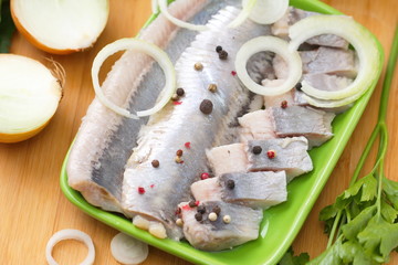 Herring fillet with herbs,onion and spices