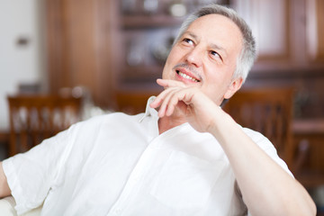 Senior man sitting on the sofa