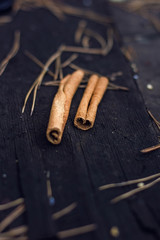 cinnamon sticks on wooden table
