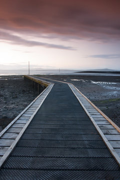 Sunset on the jetty in Morecambe Bay