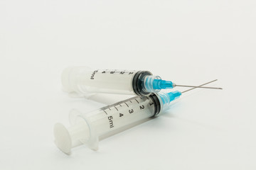 Two 5ml  disposable syringes with  blue needles