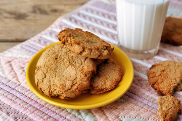 Homemade cookies and glass of milk on table close up