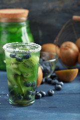Kiwi and Blueberry cocktail on wooden background