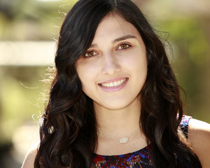 Fototapeta premium Outdoor portrait of beautiful hispanic young girl