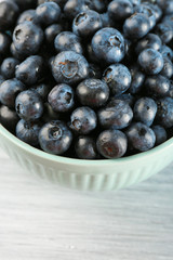 Fresh blueberries in bowl on table close up