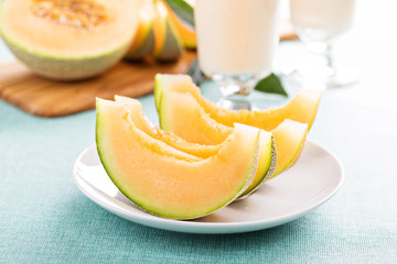 Ripe cantaloupe slices on a plate