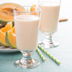 Healthy cantaloupe smoothie in a tall glass