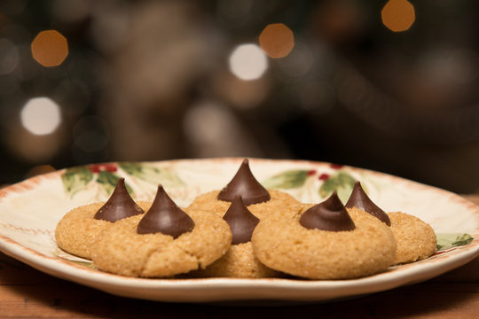 Homemade peanut butter kiss cookies on Christmas serving plate 