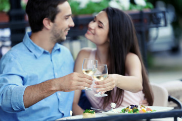 Young couple in street cafe