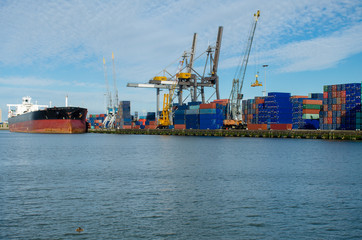 Loading/unloading shipping containers in the port of Rotterdam, Netherlands.