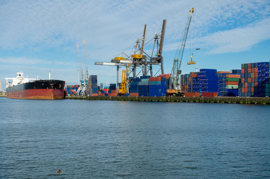 Loading/unloading shipping containers in the port of Rotterdam, Netherlands.