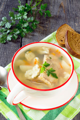 Soup with fresh fish and dumplings in a rustic style