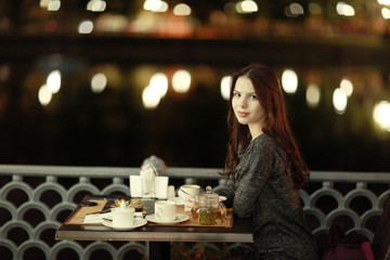 girl, night, dinner at an outdoor cafe