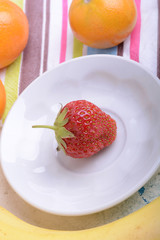 Fresh organic fruits ( strawberry, banana, mandarin, orange)