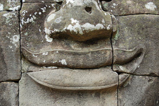 Fragment of ancient statue at Angkor Wat, Cambodia.