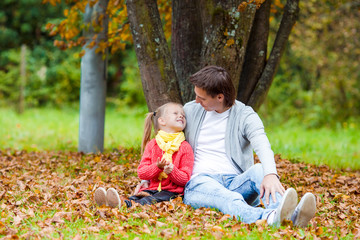 Fototapeta premium Happy family having fun on beautiful autumn day