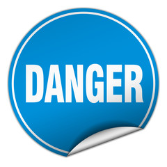 danger round blue sticker isolated on white