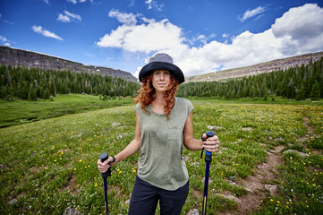 a young woman hiking in the mountains
