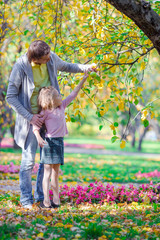 Fototapeta premium Happy family having fun on beautiful autumn day