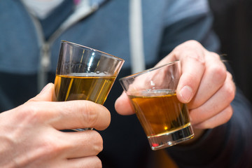 Friends having a round of drinks in a pub