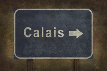 Calais roadside sign with arrow illustration in blue